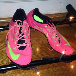 Neon pink and yellow Nike Flywire cleats